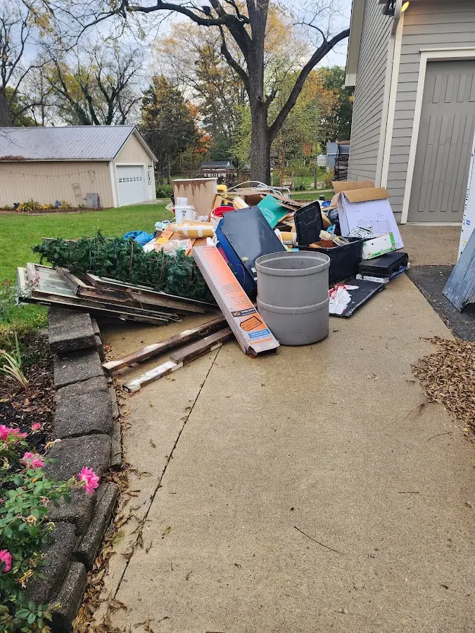 Dumpster being loaded with debris for Roofing Dumpster Rental in Fort Pierce South